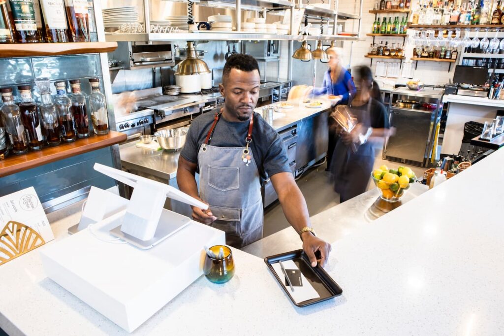 man processing card payment
