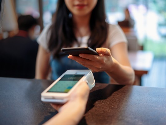 woman making card payment